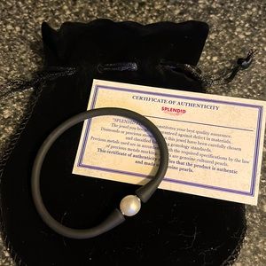 “Splendid” Black rubber and white pearl bracelet. One size fits most. NEW